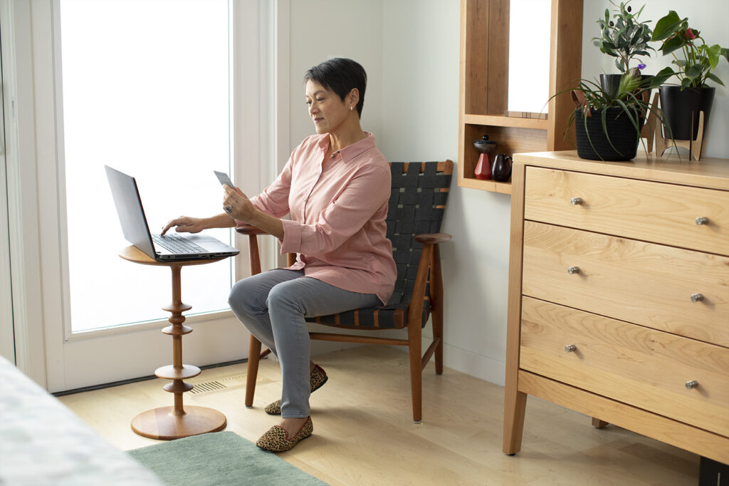 woman paying on laptop