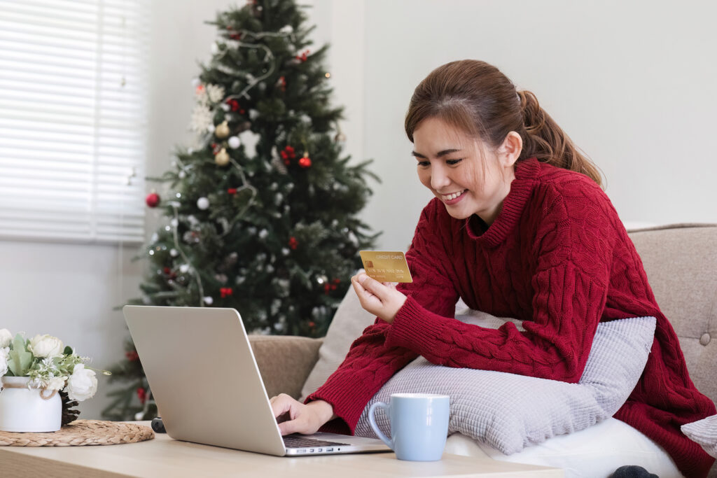 online shopping woman buying laptop using credit card