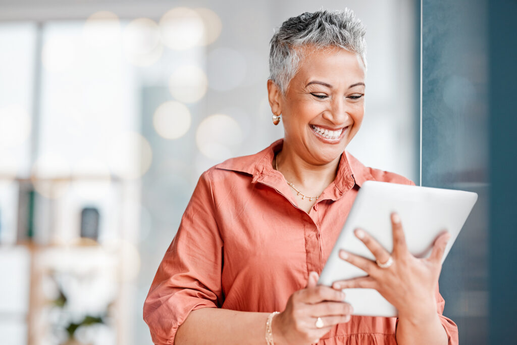 tablet ux work senior woman smile and working